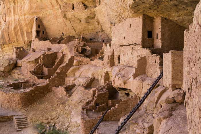 An image of the ancient Anasazi Indian ruins of Mesa Verde National Park UNESCO World Heritage Site, red sandstone cliff historic site Indian Ruins, the best example of ruins in the United States